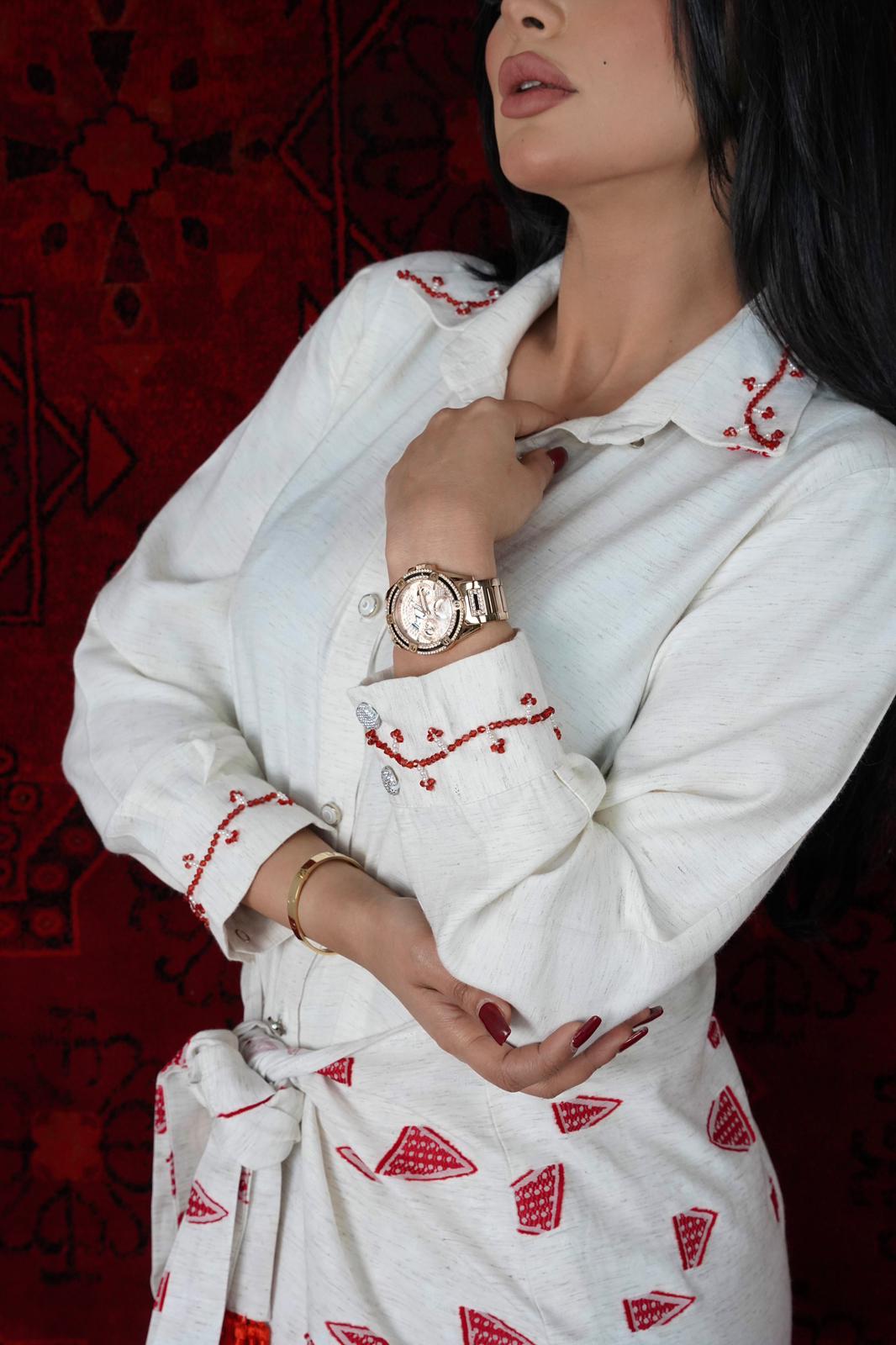 White Dress with a belt in the middle printed with red triangles