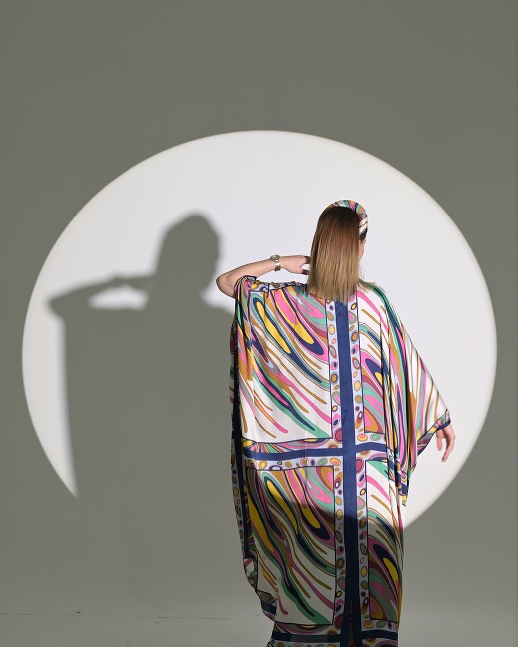 Colorful silky texture abaya with loose stripes, wide sleeves and two buttons in the front