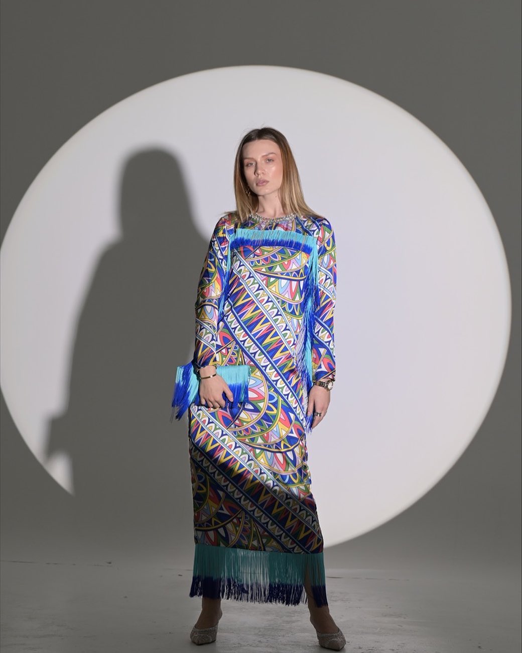Blue silk dress with small rope accessories on the sleeves and hem