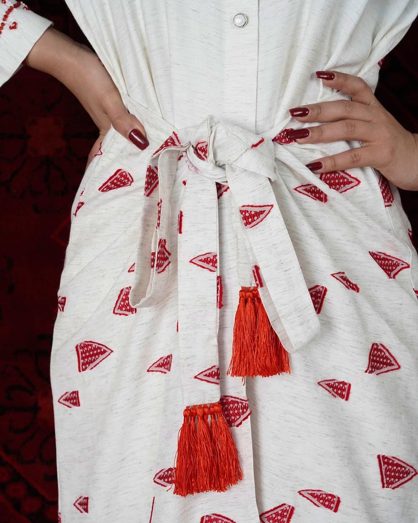 White Dress with a belt in the middle printed with red triangles