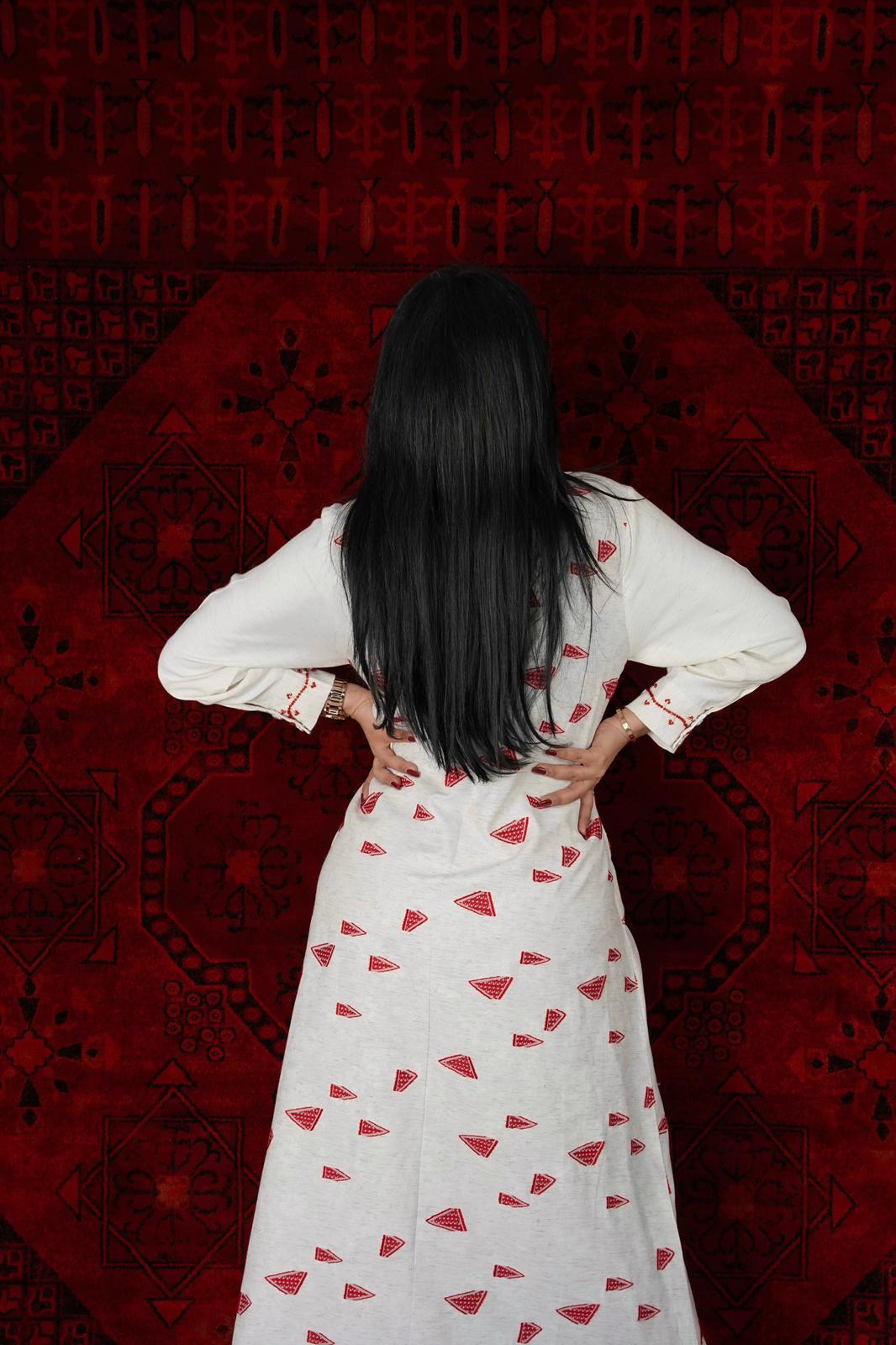White Dress with a belt in the middle printed with red triangles