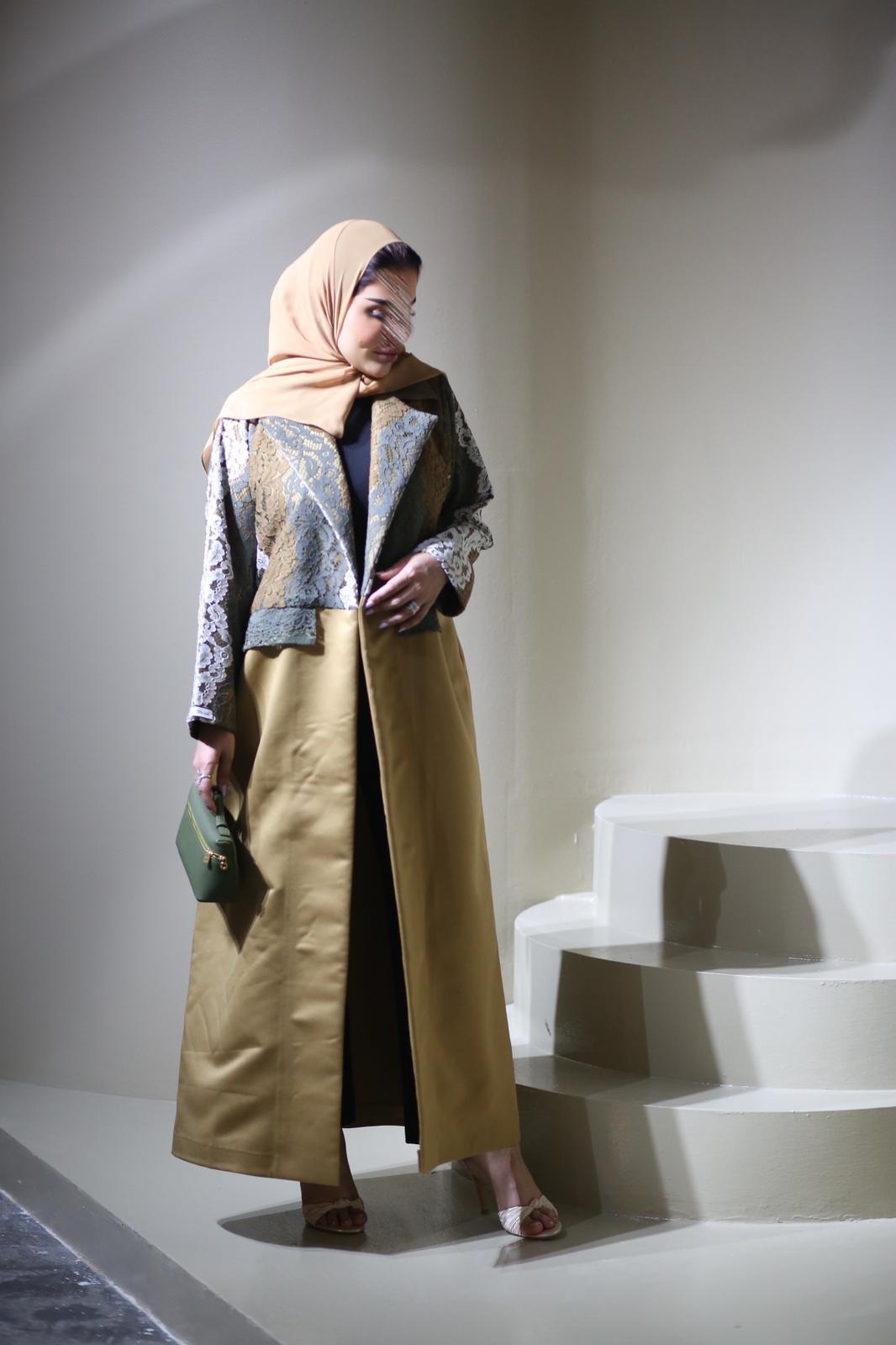 Abaya mix of elegant embroidery with shiny golden fabric