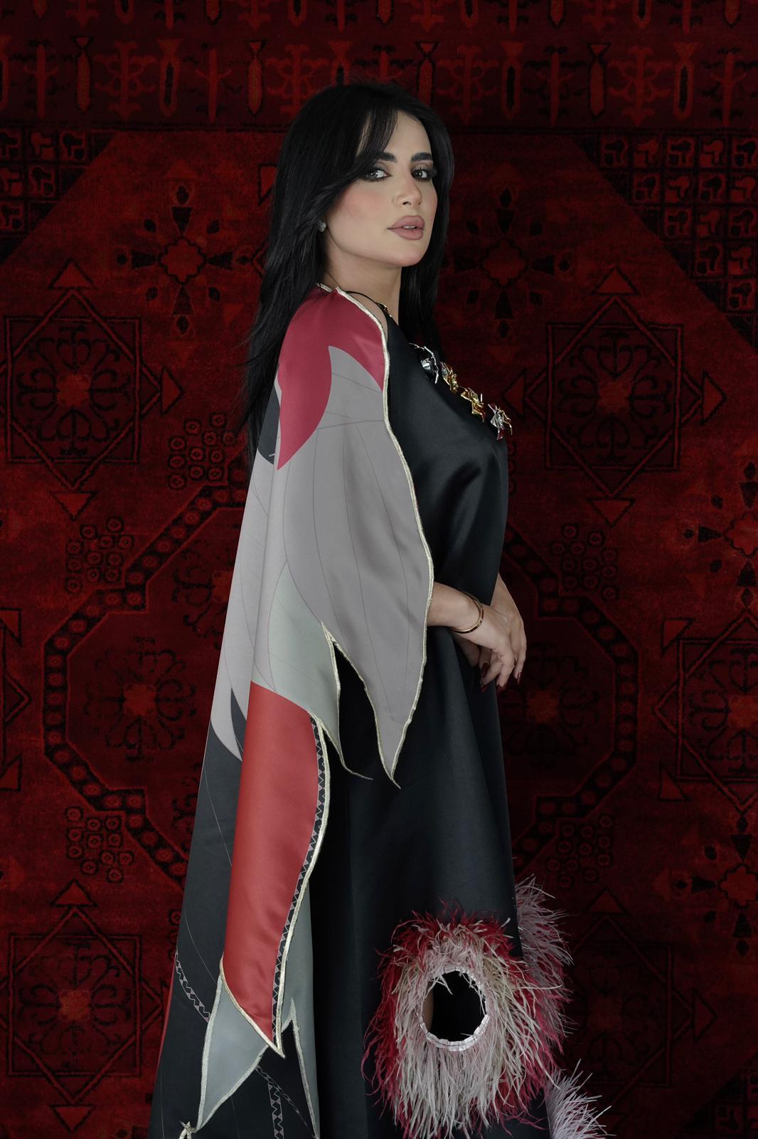 Black Dress with feather openings and butterfly back cape with roses on the chest
