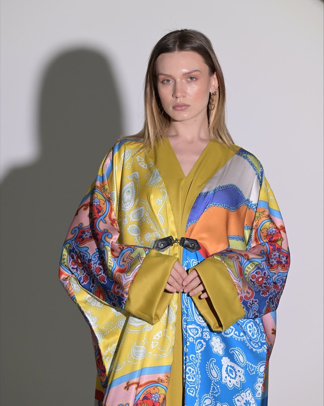 Colorful silky texture abaya with wide sleeves and two leather buttons in the front