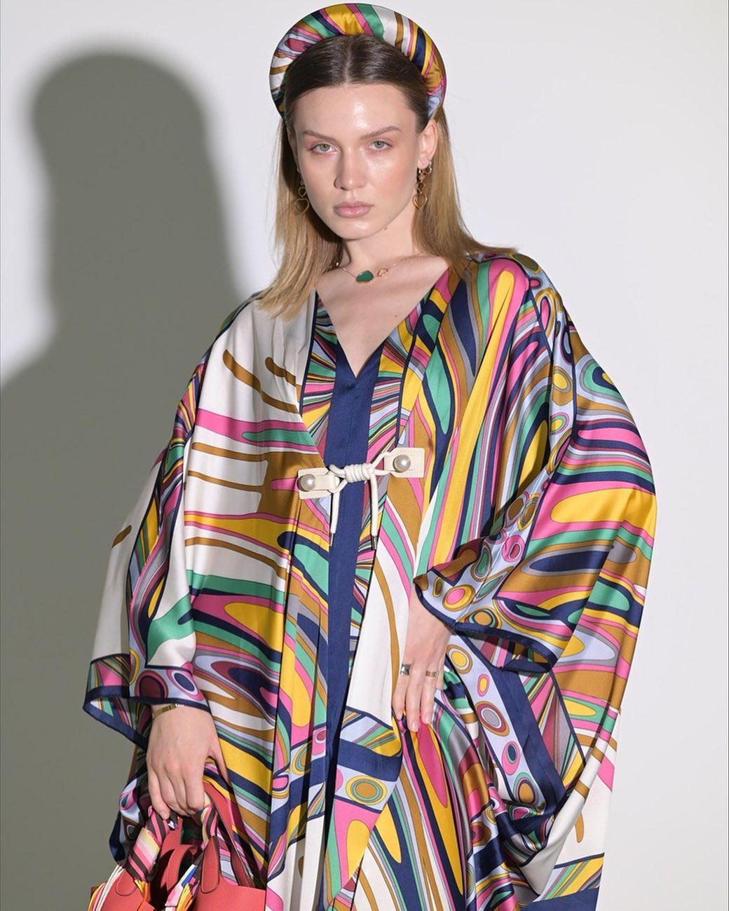 Colorful silky texture abaya with loose stripes, wide sleeves and two buttons in the front
