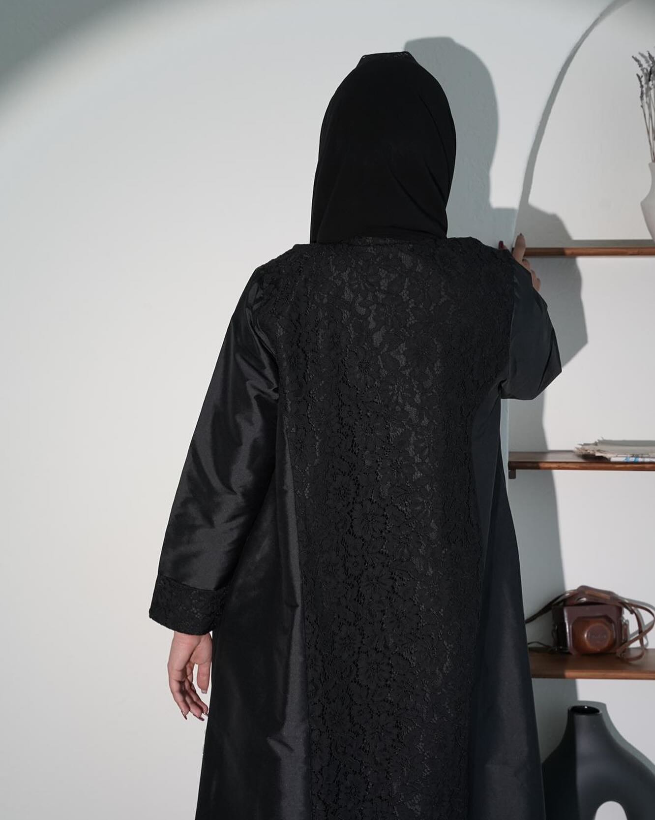 Black abaya with lace and gemstone accessories
