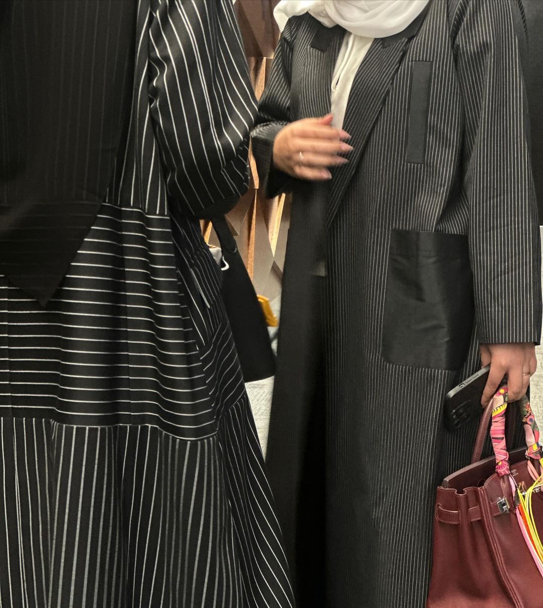 Elegant black abaya with striped pockets