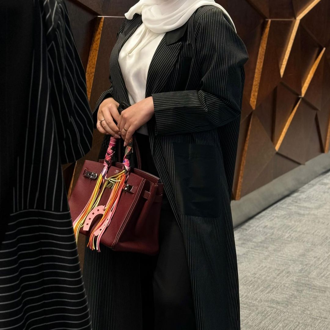 Elegant black abaya with striped pockets