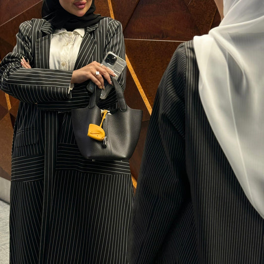 Elegant black abaya with striped pockets