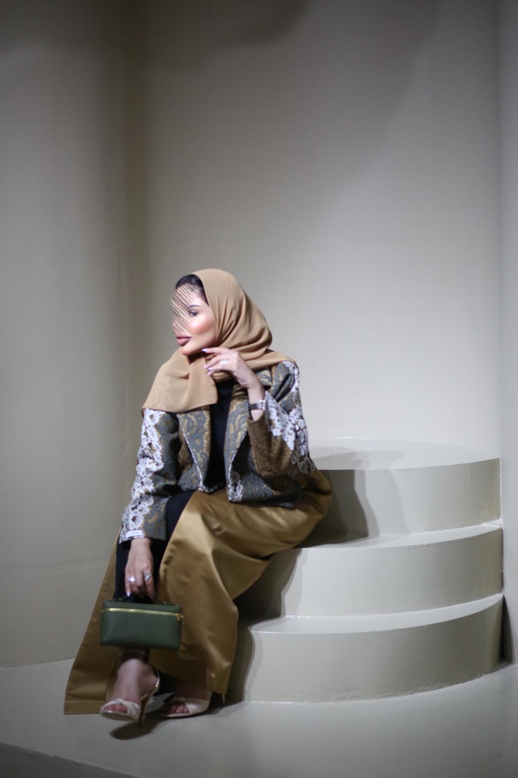 Abaya mix of elegant embroidery with shiny golden fabric