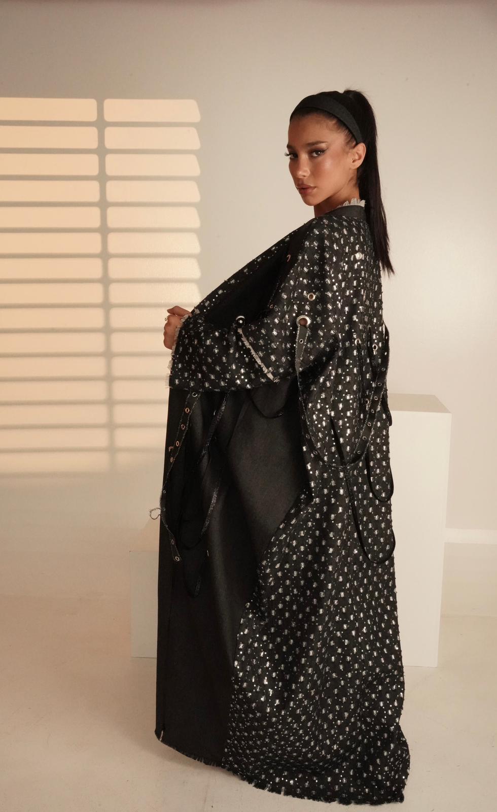 Abaya with metal rings and shiny fabric