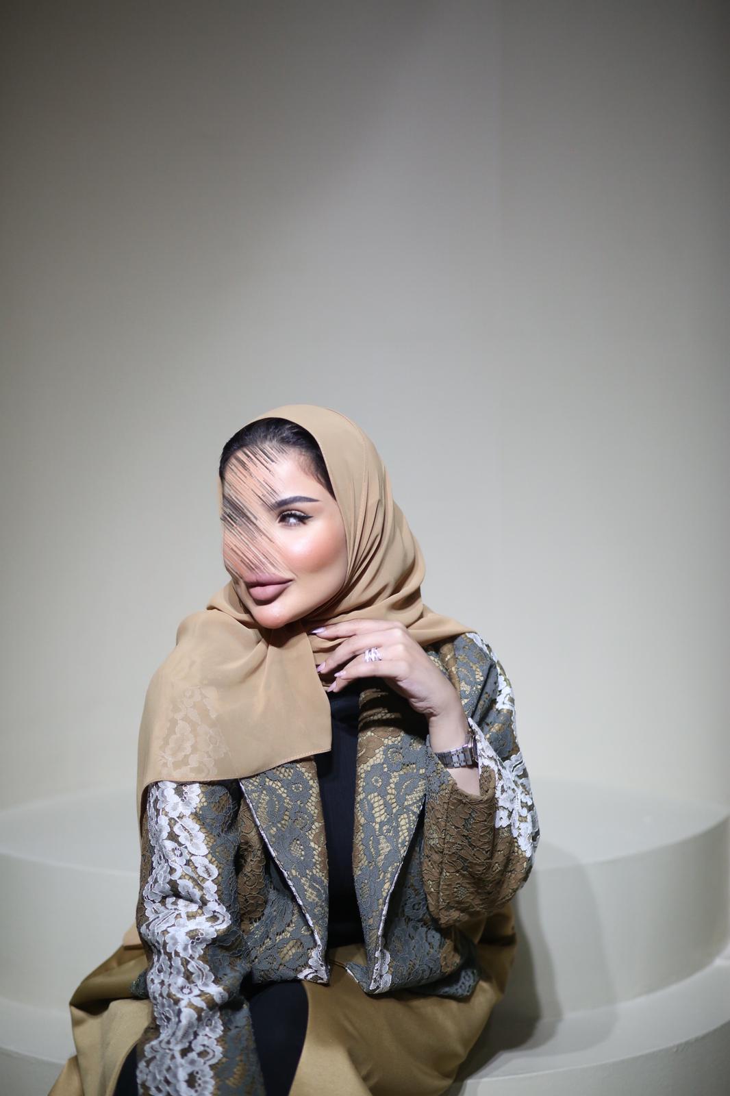 Abaya mix of elegant embroidery with shiny golden fabric