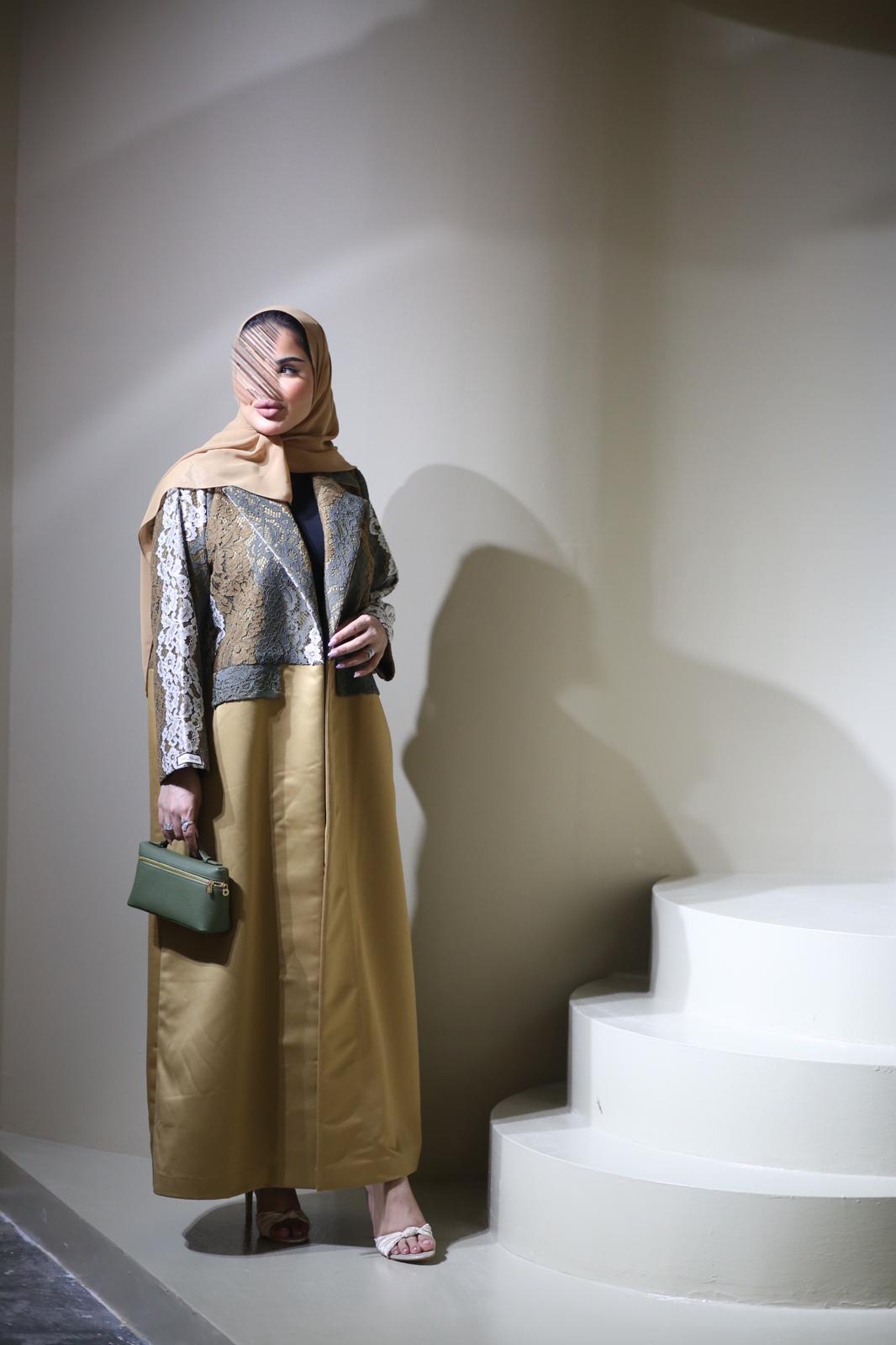 Abaya mix of elegant embroidery with shiny golden fabric