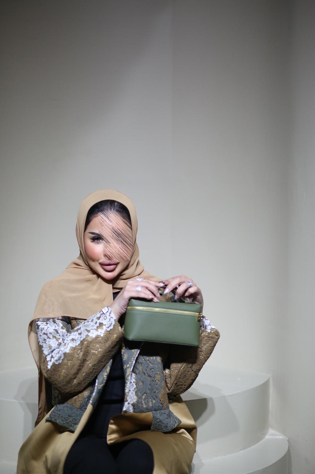 Abaya mix of elegant embroidery with shiny golden fabric