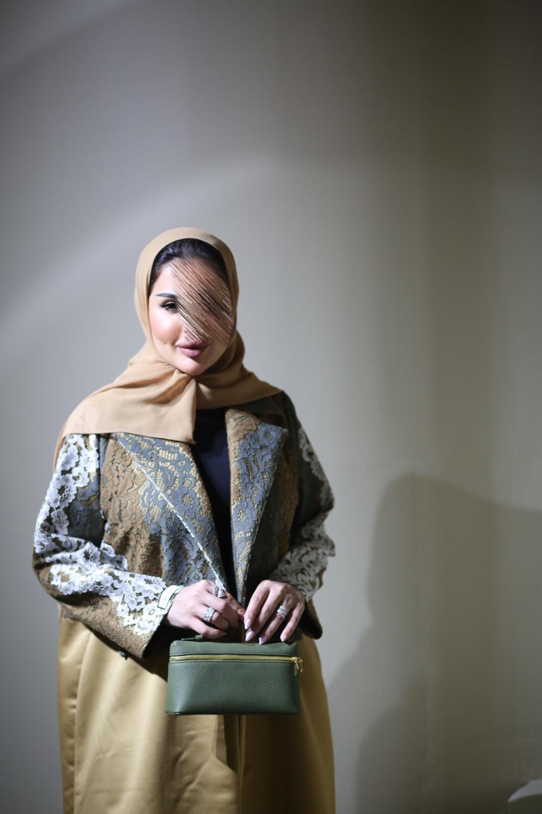 Abaya mix of elegant embroidery with shiny golden fabric
