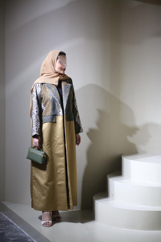 Abaya mix of elegant embroidery with shiny golden fabric